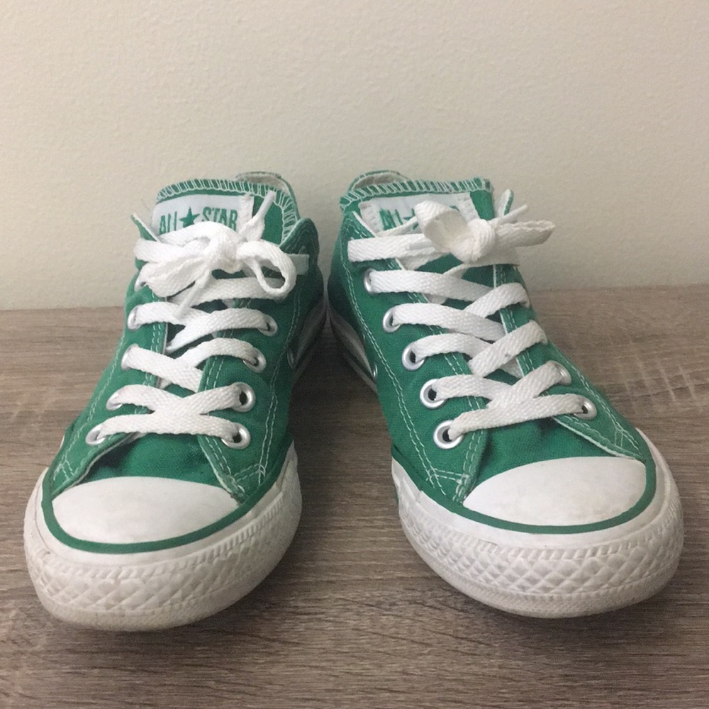 Bright green low-top Converse, size 7.